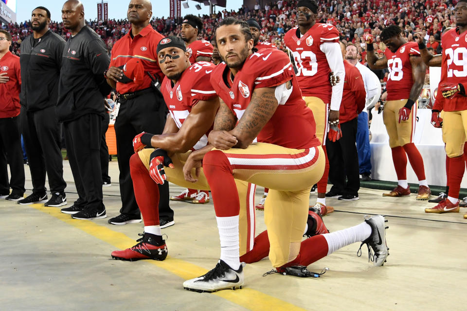 Colin Kaepernick #7 and Eric Reid #35 of the San Francisco 49ers kneel in protest during the national anthem prior to playing the Los Angeles Rams in their NFL game at Levi's Stadium on September 12, 2016 in Santa Clara, California. (Photo by Thearon W. Henderson/Getty Images)