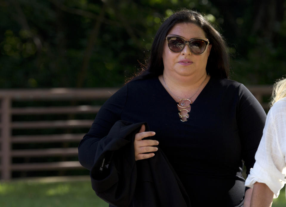 Lee Elbaz arrives at federal court for jury selection in her trial in Greenbelt, Md., Tuesday July 16, 2019. Elbaz was CEO of an Israel-based company called Yukom Communications. She is accused of engaging in a scheme to dupe investors through the sale and marketing of financial instruments known as "binary options." (AP Photo/Jose Luis Magana)