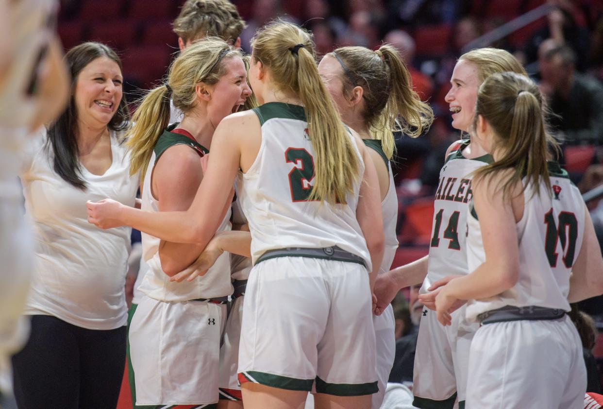 Teammates gather to congratulate Lincoln's Kloe Froebe, second from left, after her 45-point performance against Deerfield in the Class 3A state semifinals Friday, March 3, 2023 at CEFCU Arena in Normal. The Railers advanced to the title game with a 76-56 victory.