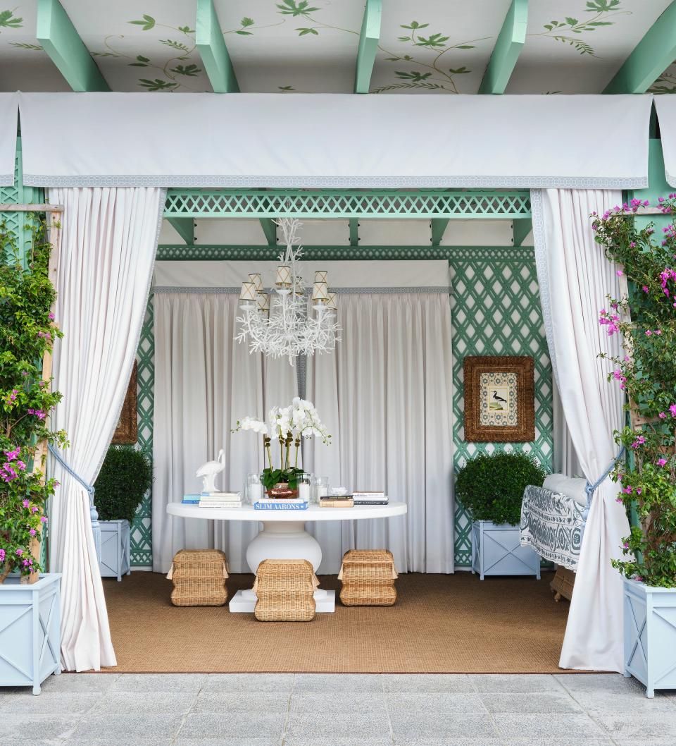 For her terrace space, designer Ariel Okin topped the pergolas with a ceiling with botanical motifs painted by West Palm Beach artist Joseph Steiert. The terrace is on the top floor of the Kips Bay Decorator Show House Palm Beach.