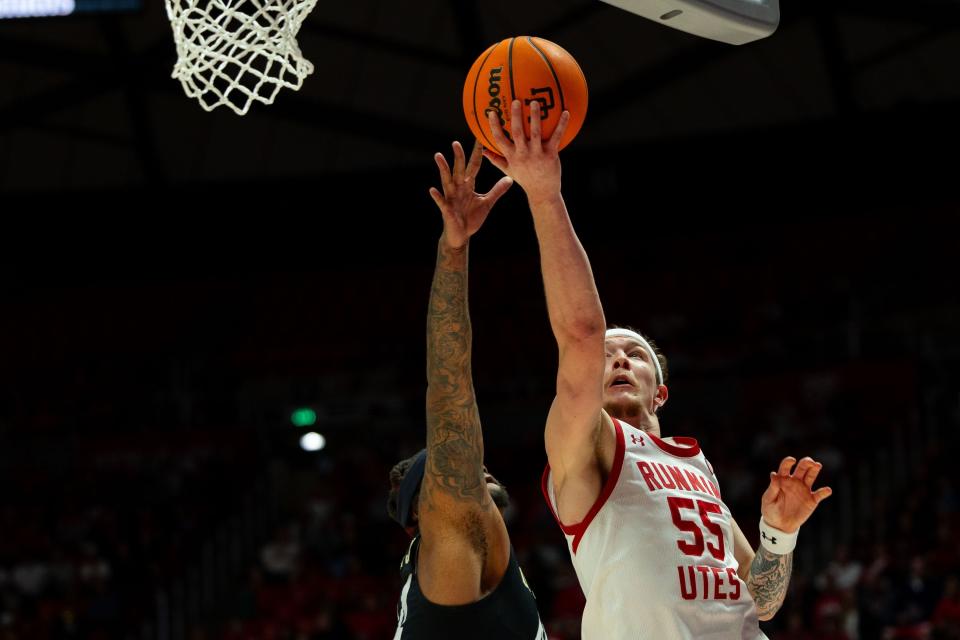 Utah Utes guard Gabe Madsen (55) shoots the ball with Colorado Buffaloes center Eddie Lampkin Jr. (44) on defense during the men’s college basketball game between the Utah Utes and the Colorado Buffaloes at the Jon M. Huntsman Center in Salt Lake City on Saturday, Feb. 3, 2024. | Megan Nielsen, Deseret News