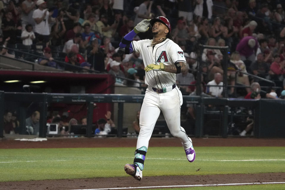 Arizona Diamondbacks' Ketel Marte reacts after hitting a solo home run against the Minnesota Twins in the fourth inning during a baseball game, Thursday, June 27, 2024, in Phoenix. (AP Photo/Rick Scuteri)