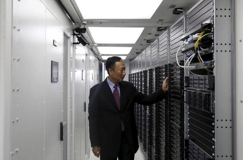 Terry Gou, founder and chairman of Taiwan's Foxconn Technology, poses inside a container for Foxconn's data servers, at a company's data centre in Guiyang, Guizhou province, China, in this May 26, 2015 file photo. REUTERS/Paul Carsten/Files