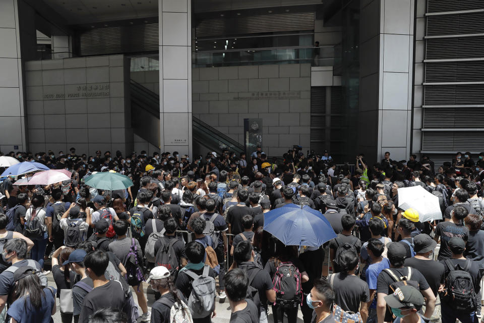 Protesters gather outside the police headquarters in Hong Kong on Friday, June 21, 2019. Several hundred mainly student protesters gathered outside Hong Kong government offices Friday morning, with some blocking traffic on a major thoroughfare, after a deadline passed for meeting their demands related to controversial extradition legislation that many see as eroding the territory's judicial independence. (AP Photo/Kin Cheung)