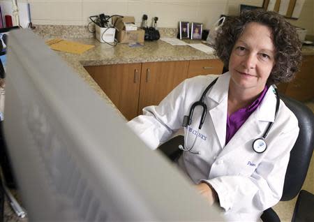 Dr. Pamela Banister poses while working at a clinic which is part of the Singing River Health System in Pascagoula, Mississippi September 26, 2013. REUTERS/Lyle Ratliff