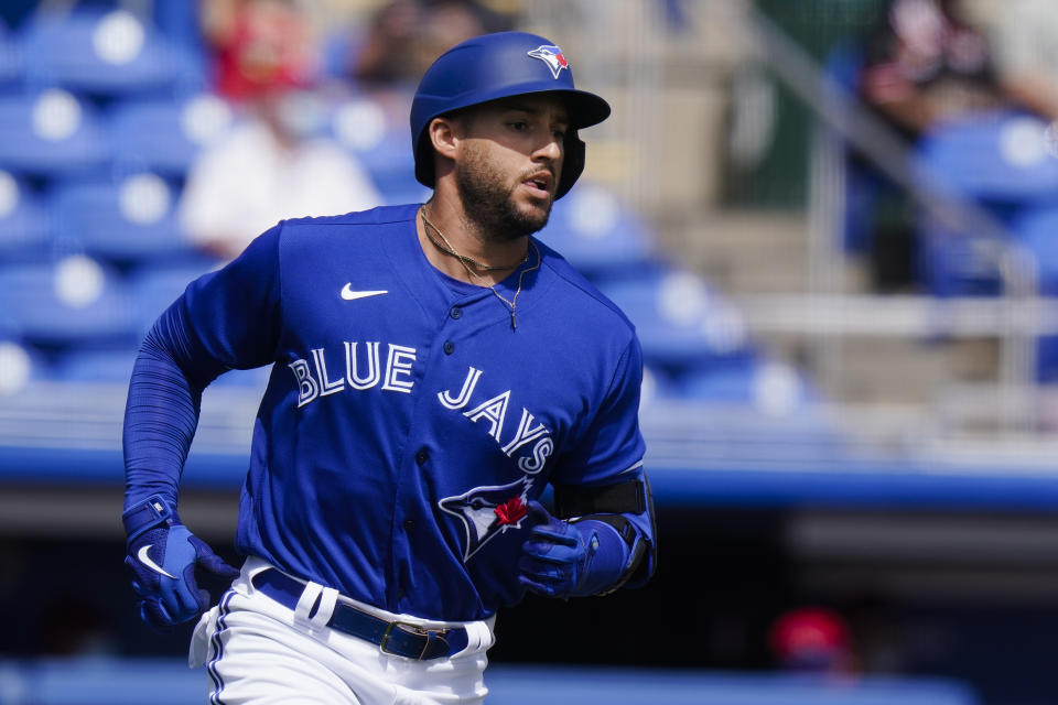 Toronto Blue Jays' George Springer runs to first base for a single during the first inning of a spring baseball game against the Philadelphia Phillies on Tuesday, March 2, 2021, in Dunedin, Fla. The Blue Jays won 4-2. (AP Photo/Frank Franklin II)