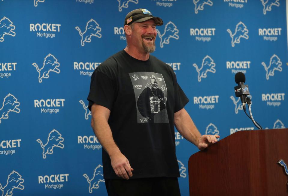 Detroit Lions head coach Dan Campbell talks with reporters about the third day of OTAs, Thursday, May 25, 2023 in Allen Park. Near the end, Campbell had fun taking a few questions about his T-shirt with GM Brad Holmes on the front.