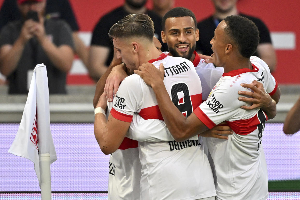 Stuttgart's players celebrate their side's third goal during a German Bundesliga soccer match between VfB Stuttgart and Borussia Dortmund in Stuttgart Germany, Sunday, Sept. 22, 2024. (Jan-Philipp Strobel/dpa via AP)