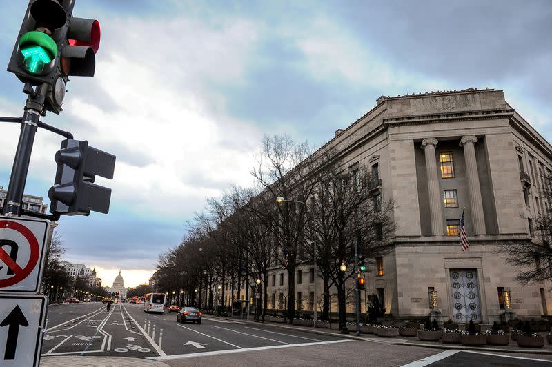 FILE PHOTO: The U.S. Department of Justice building is bathed in morning light at sunrise in Washington