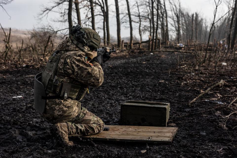 A Ukrainian soldier fires with an AK-47 during training at an undetermined location in Donetsk Oblast, Ukraine on February 02, 2024.