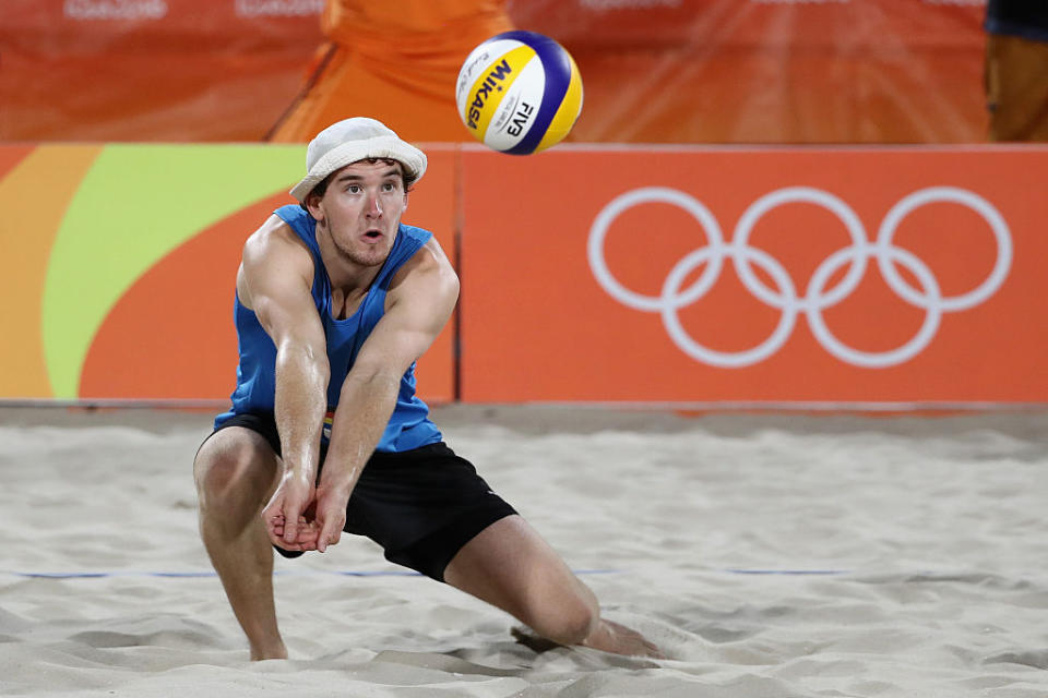 Lars Fluggen, a German beach volleyball player, competes in pool play of the 2016 Olympics. (Getty)