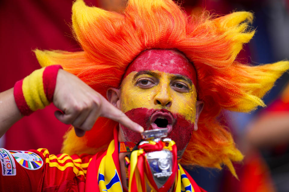 A Spanish supporter cheers in the stand before to a Group B match between Spain and Croatia at the Euro 2024 soccer tournament in Berlin, Germany, Saturday, June 15, 2024. Spain defeated Croatia 3-0. (AP Photo/Manu Fernandez)