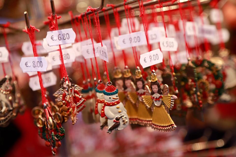 NUREMBERG, GERMANY - NOVEMBER 30: Christmas decorations hang for sale at a stand at the traditional Christmas market 'Nuernberger Christkindlesmarkt' ahead of the opening ceremony on November 30, 2012 in Nuremberg, Germany. Originated in the 16th century the Nuremberg Christmas market is seen as one of the oldest of its kind in Germany. (Photo by Johannes Simon/Getty Images)