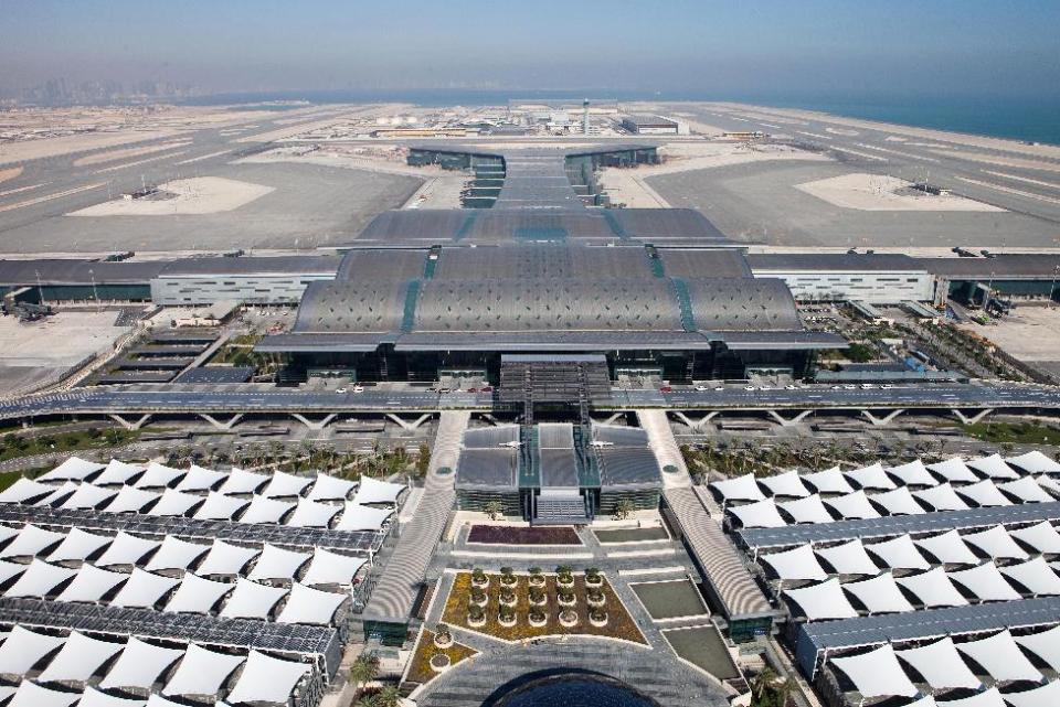 This undated image released by the New Hamad International Airport (HIA) which opened on Wednesday, April 30, 2014, shows an aerial view of the airport. The massive new airport in the Qatari capital has started handling its first commercial flights after years of delays as the natural-gas rich Gulf nation works to transform itself into a major aviation hub.(AP Photo/HIA)