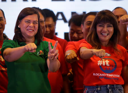 Davao City Mayor Sara Duterte-Carpio (L) and Ilocos Norte Governor Imee Marcos gestures during an alliance meeting with local political parties in Paranaque, Metro Manila in Philippines, August 13, 2018. Picture taken August 13, 2018. REUTERS/Czeasar Dancel