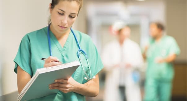 USA, New Jersey, Jersey City, Female doctor in hospital hallway