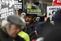 People demonstrate for higher wages and better working conditions, outside of a Walmart during Black Friday shopping in Chicago November 28, 2014. REUTERS/Andrew Nelles