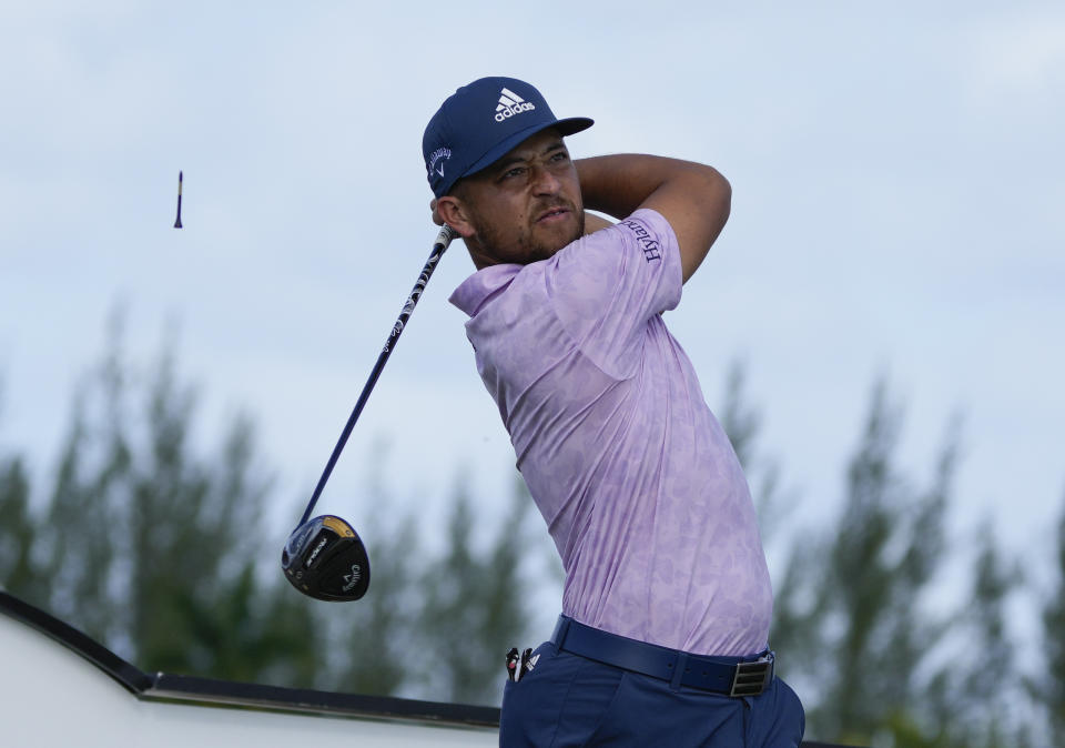 Xander Schauffele, of the United States, watches his shot on the third tee during the final round of the Hero World Challenge PGA Tour at the Albany Golf Club in New Providence, Bahamas, Sunday, Dec. 4, 2022. (AP Photo/Fernando Llano)