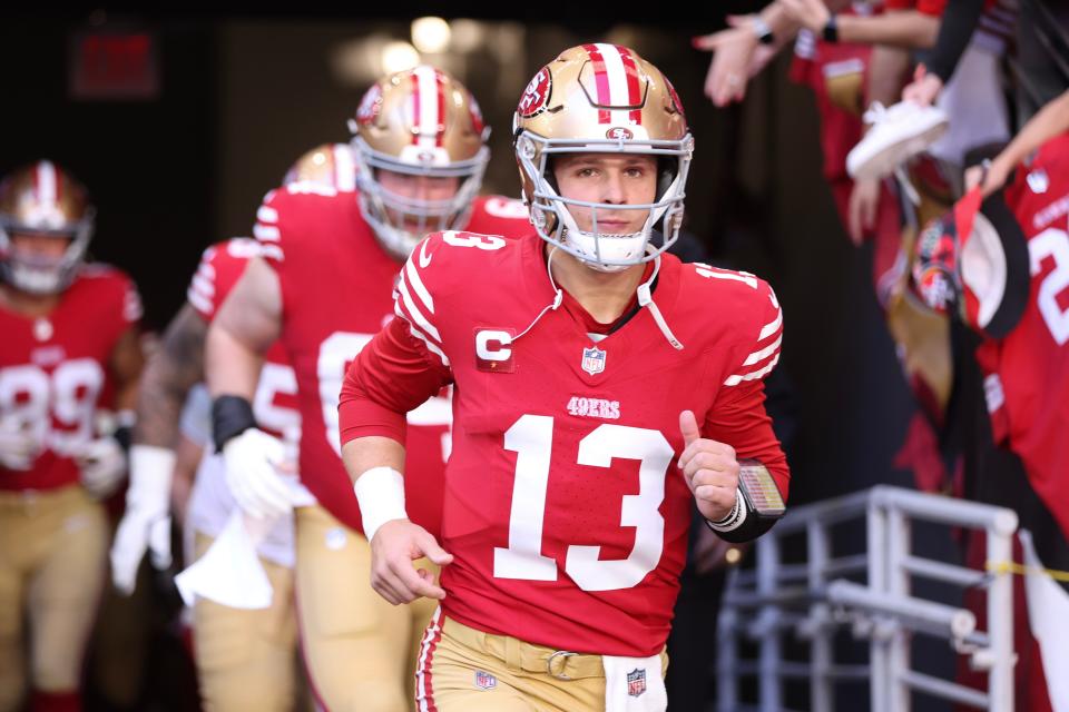 Brock Purdy #13 of the San Francisco 49ers takes to the field prior to a game against the Arizona Cardinals at State Farm Stadium on Dec. 17, 2023, in Glendale, Arizona.