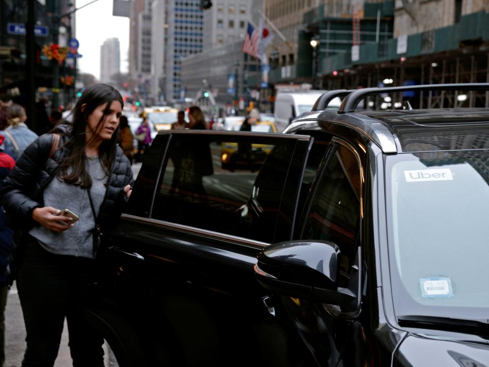 A passenger enters an Uber car in New York City, New York, U.S., December 6, 2019.