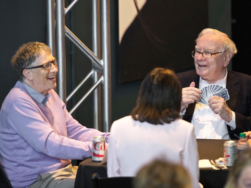 Berkshire Hathaway Chairman and CEO Warren Buffett, right, plays bridge with Microsoft co-founder and director with Berkshire Hathaway Bill Gates outside the company-owned Borsheims jewelry store in Omaha, Neb., Sunday, May 7, 2017, as the annual Berkshire Hathaway shareholders meeting comes to an end.