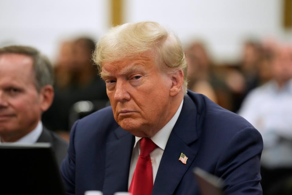 Former U.S. President Donald Trump appears in the courtroom with his lawyers for his civil fraud trial at New York State Supreme Court in New York City on Oct. 3, 2023.