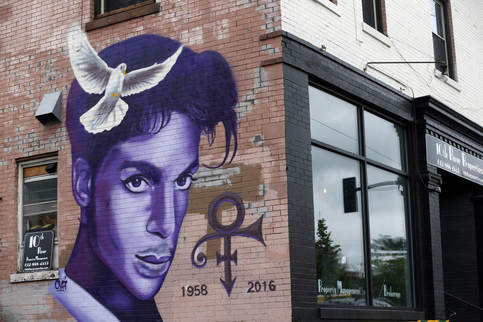 FILE - In this Aug 28, 2016, file photo, a mural honoring the late Prince adorns a building in the Uptown area of Minneapolis. The one-year anniversary of the rock star, who died of an overdose at the age of 57, is April 21. (AP Photo/Jim Mone, File)