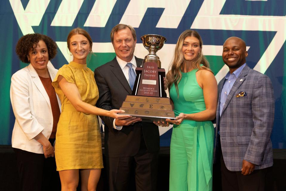 Kent State representatives pose with the 2021-22 Jacoby Trophy, awarded annually to the top overall women's athletic program in the Mid-American Conference. Pictured (from left) are Golden Flashes Executive Senior Associate Athletics Director Suzette McQueen, Eva Nikolai (women's lacrosse), MAC Commissioner Jon Steinbrecher, Cameron Shedenhelm (soccer), and KSU Director of Athletics Randale Richmond.