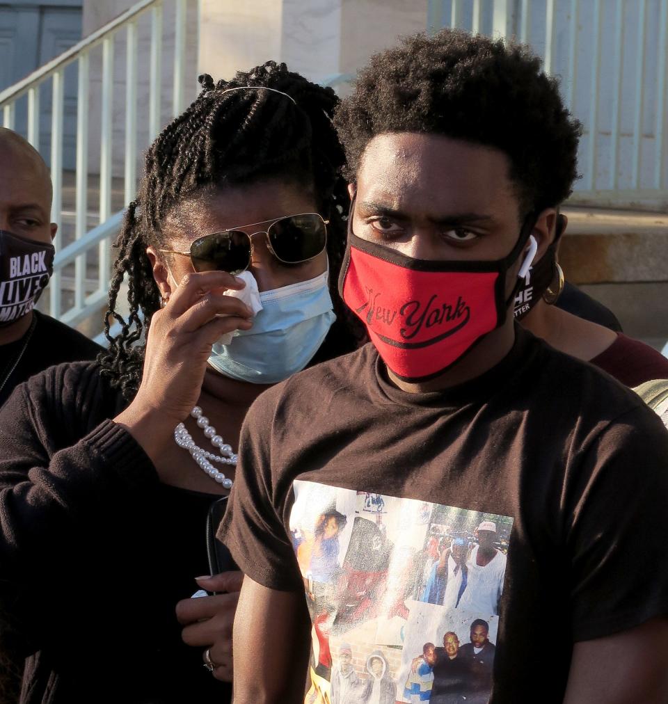 Kenisha White and son Dayvon White wait to speak at a news conference outside the Asbury Park Post Office Wednesday evening, September 23, 2020, that demanded action in the wake of Hasani Best's death.