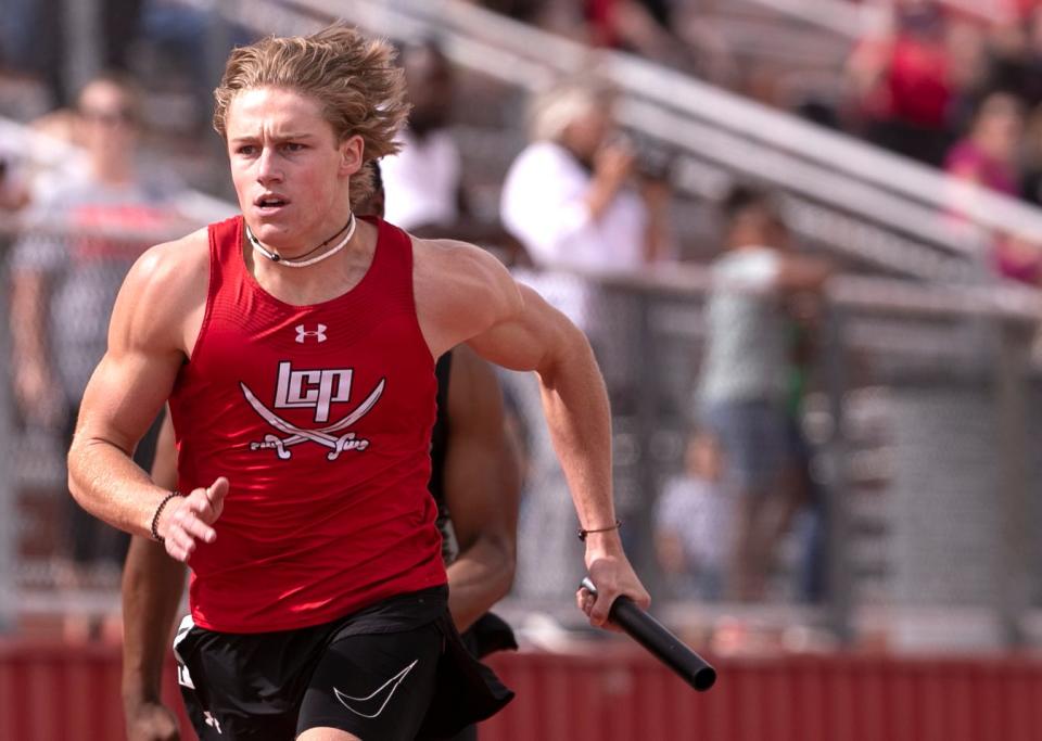 Lubbock-Cooper’s 400 meter relay team competes in the District 4-5A track and field meet, Thursday, April 13, 2023, at Pirate Stadium in Woodrow. 