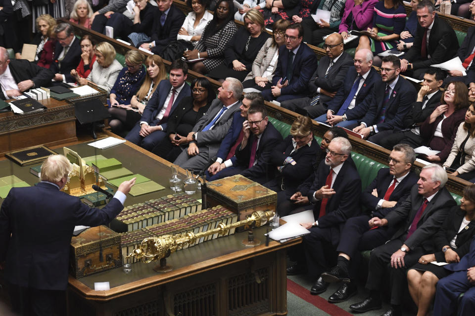 In this handout photo provided by the House of Commons, Britain's Prime Minister Boris Johnson, left, speaks in Parliament in London, Wednesday, Sept. 25, 2019. An unrepentant Prime Minister Boris Johnson brushed off cries of “Resign!” and dared the political opposition to try to topple him Wednesday at a raucous session of Parliament, a day after Britain’s highest court ruled he acted illegally in suspending the body ahead of the Brexit deadline. (Jessica Taylor/House of Commons via AP)