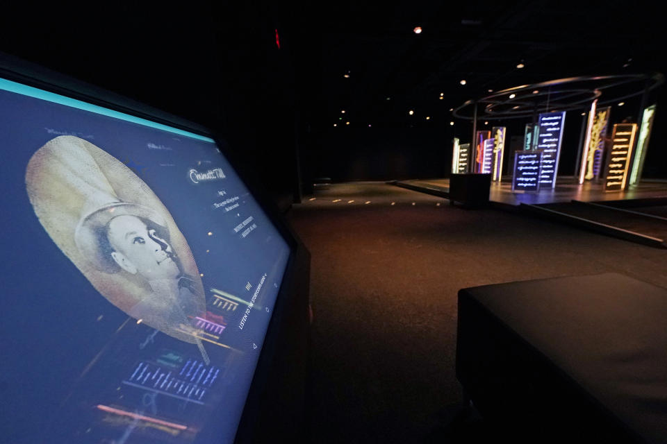 An interactive kiosk, left, sits across from the PBS Frontline's traveling augmented-reality exhibit, "Un(re)solved" in the special exhibit room, Friday, Aug. 27, 2021. The exhibit was opened on Saturday, Aug. 28, to align with the commemoration of the death of Emmett Till, a Chicago teenager who was lynched in Mississippi in 1955. The multi-media platforms examine the federal government's efforts to investigate more than 150 civil rights era cold cases on the Emmett Till Unsolved Civil Rights Crime Act. (AP Photo/Rogelio V. Solis)