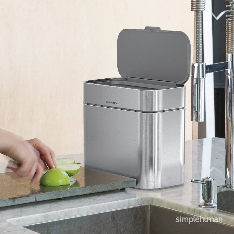 The compost container sits on a countertop