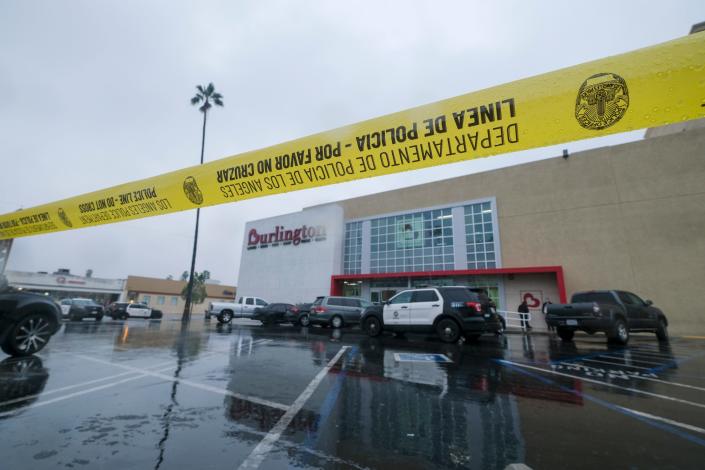 Police yellow tape blocks the scene where two people were struck by gunfire at a Burlington store in North Hollywood, Calif., on Dec. 23.