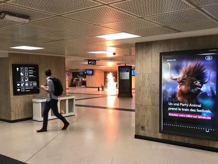 Fire is seen at Brussels central station in Brussels, Belgium. Twitter/@remybonnaffe/via REUTERS