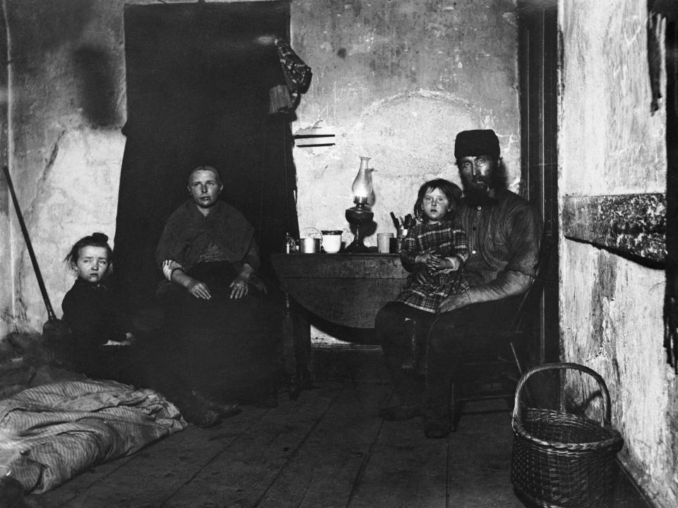 A poverty-stricken family living in New York’s Lower East Side, circa 1890.