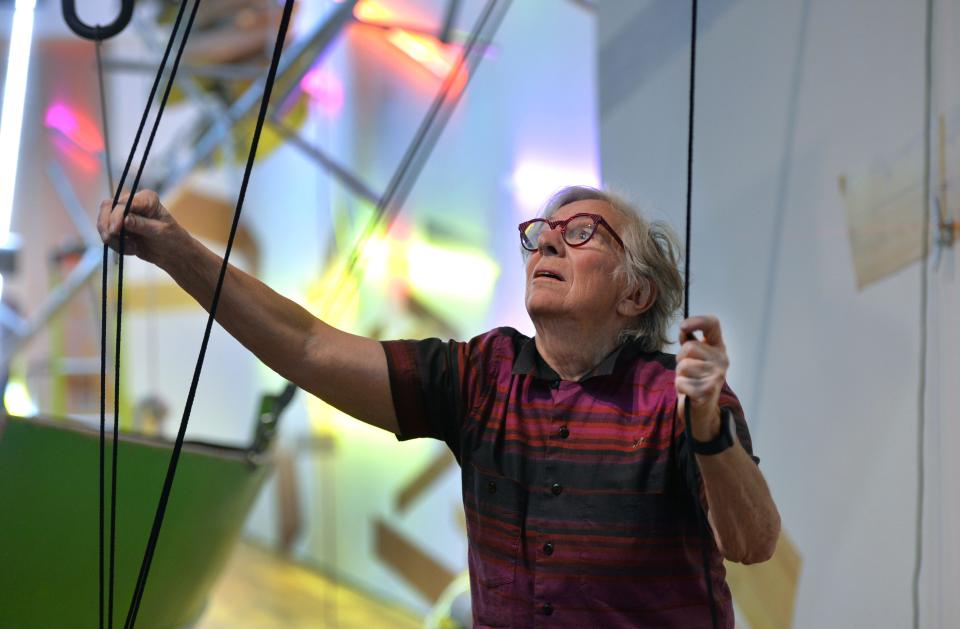Artist Judy Pfaff makes adjustments to some of the suspended objects in her installation titled, Picking up the Pieces, at the Sarasota Art Museum of Ringling College of Art and Design. Half the exhibit recognizes the natural beauty and abundance of Florida. The site-specific half of the installation is a result of Pfaff's exploration of Fort Myers Beach and Sanibel Island following Hurricane Ian.