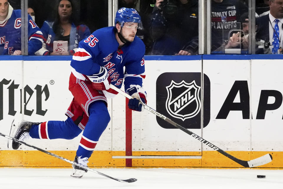 New York Rangers defenseman Ryan Lindgren (55) skates with the puck during the second period against the Carolina Hurricanes in Game 1 of an NHL hockey Stanley Cup second-round playoff series, Sunday, May 5, 2024, in New York. (AP Photo/Julia Nikhinson)