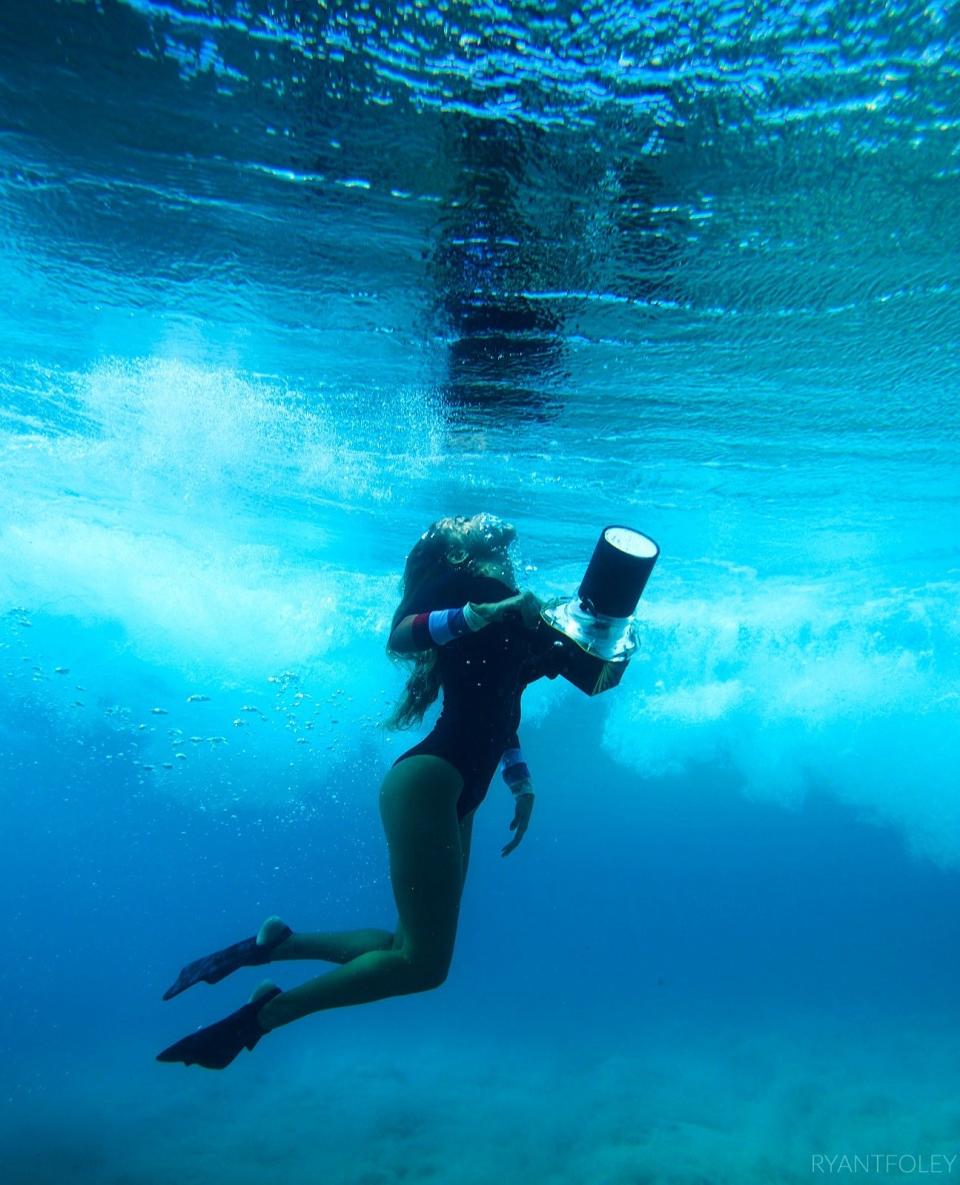 When she goes deep into the waves for her photos, Amber switches up her outfit completely. "A classic one-piece with long-sleeves are typically what photographers and surfers in Hawaii wear," she explained. "The good thing is a lot of them have built-in UV protection, so you don't even have to put sunscreen on, the rash guard protects you."