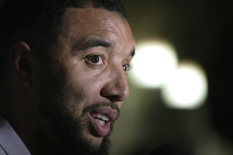 Former Premier League player Troy Deeney speaks during an interview in London, Thursday, March 21, 2024. Racism has long permeated the world’s most popular sport, with soccer players subjected to racist chants and taunts online. While governing bodies like FIFA and UEFA have taken steps to combat the abuse of players, the lack of diversity in the upper ranks at major clubs remains an unsolved problem. Deeney was hired as head coach of fourth tier Forest Green Rovers in December, but was fired less than a month later. (AP Photo/Kin Cheung)