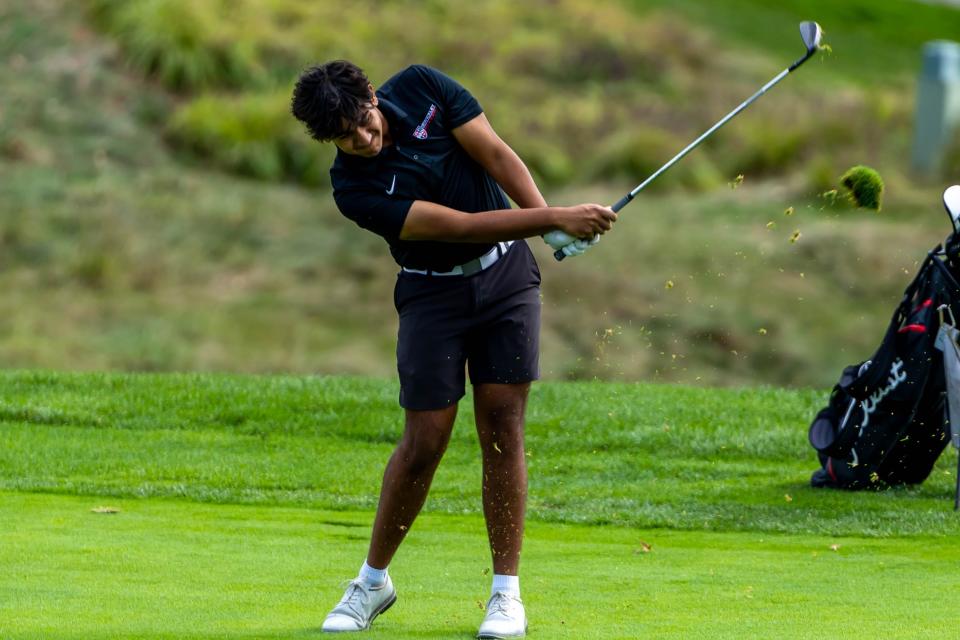 Sewickley Academy senior Karan Kad follows through after his shot on fariway No. 8 during the WPIAL Class AA Boys Individual Championship at Sewickley Heights Golf Club on Wednesday.