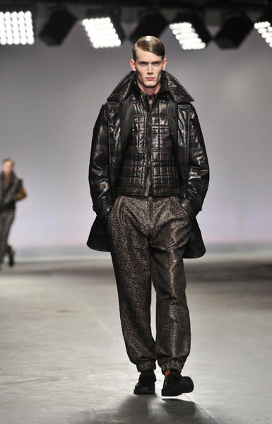 <b>Model, James Long</b><br><br>This model walks the catwalk for the James Long AW13 show decked out in gunmetal grey.