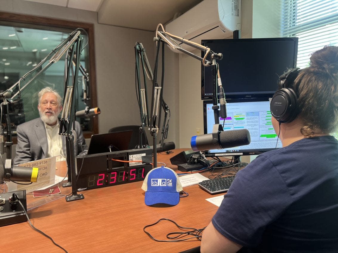 KBIA general manager Mike Dunn, left, speaks during a segment with KBIA reporter Rebecca Smith on Monday as the public radio station at the University of Missouri celebrated its 50th anniversary on the air.