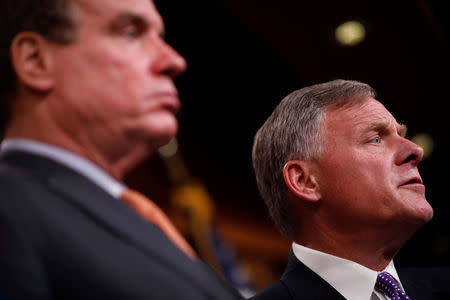 Sen. Richard Burr (R-NC), accompanied by Sen. Mark Warner (D-VA), gives an update on the ongoing investigation into Russian involvement in the 2016 election at the Capitol Building in Washington, U.S., October 4, 2017. REUTERS/Aaron P. Bernstein