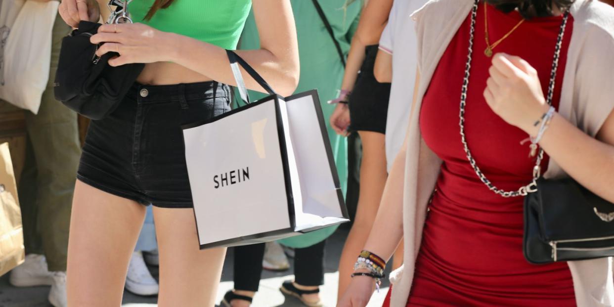 madrid, spain june 02 a woman with a shein bag after entering sheins first physical store in madrid, june 2, 2022, in madrid, spain chinese online fashion brand shein opens its first pop up store in madrid following the good reception it has had recent similar openings in countries such as france, mexico and the united states the store opens its doors today and will be open until june 5, where customers will be able to shop for womens and mens fashion collections photo by cezaro de lucaeuropa press via getty images
