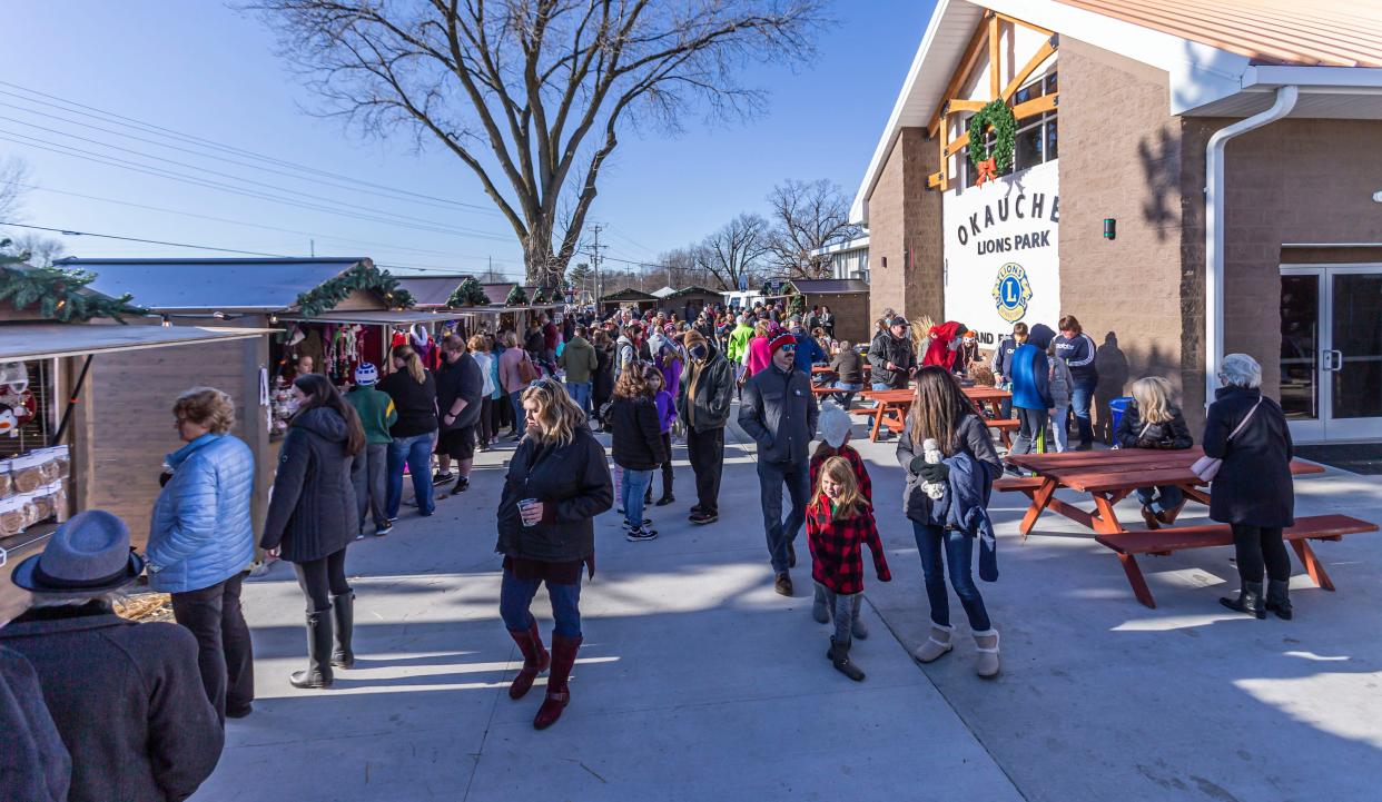 Visitors enjoy the holiday market during Christmas in Okauchee in 2020. The three-day traditional open air holiday market and festival at Okauchee Lions Park featured live music, dancing, food and more.