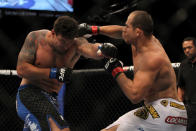 LAS VEGAS, NV - MAY 26: (R-L) Junior dos Santos punches Frank Mir during the Heavyweight Championship bout at UFC 146 at MGM Grand Garden Arena on May 26, 2012 in Las Vegas, Nevada.