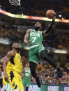 Boston Celtics guard Jaylen Brown (7) shoots over Indiana Pacers forward Thaddeus Young (21) during the first half of Game 4 of an NBA basketball first-round playoff series in Indianapolis, Sunday, April 21, 2019. (AP Photo/Michael Conroy)