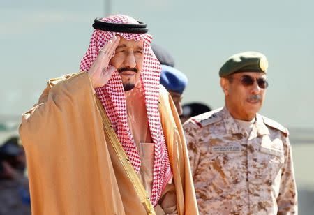 Saudi King Salman salutes as he attends a graduation ceremony and air show marking the 50th anniversary of the founding of King Faisal Air College in Riyadh, Saudi Arabia, January 25, 2017. REUTERS/Faisal Al Nasser - RTSXA41