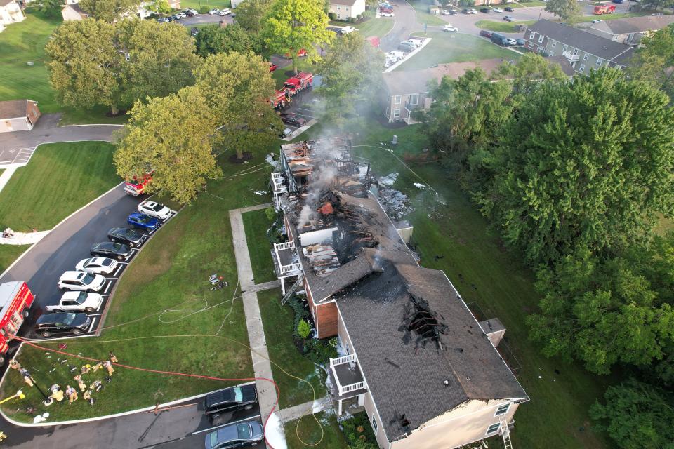 Flames could be seen from the roof of an apartment fire in Washington Township early Thursday morning.